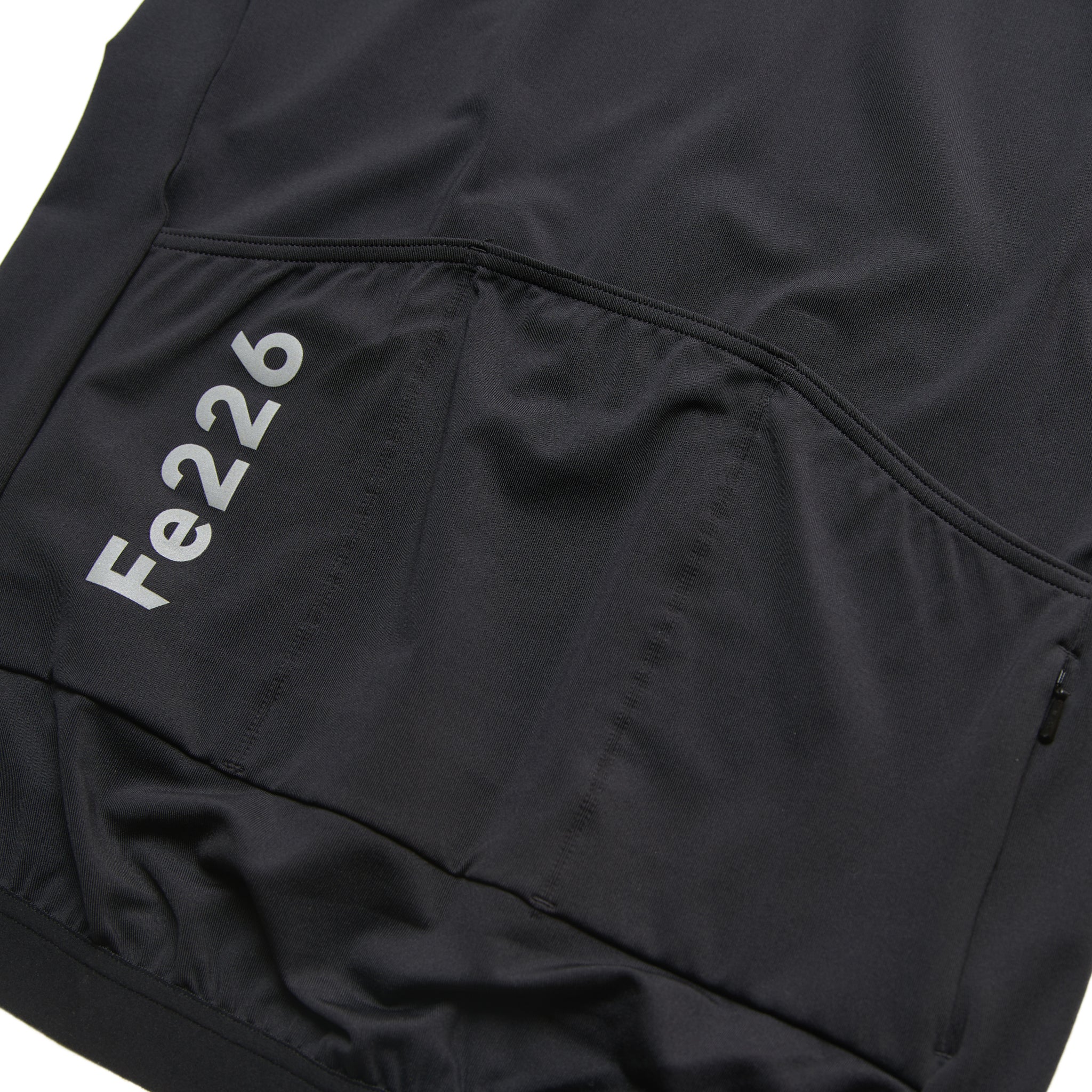 The Fe226 Black Cycling Jersey has an aero dynamic race fit with comfortable feel, three back pockets, a zipped security pocket and reflective logo prints to keep you visible in the dark. High quality race fitted odourless summer cycling jersey for road cycling, Gravel, MTB, triathlon training, commuting and racing.